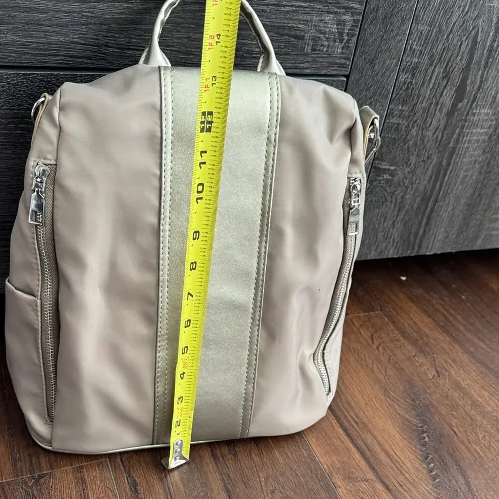 Neutral Taupe Woman’s Backpack with Metallic Accent and many zipper pockets. - Picture 10 of 13